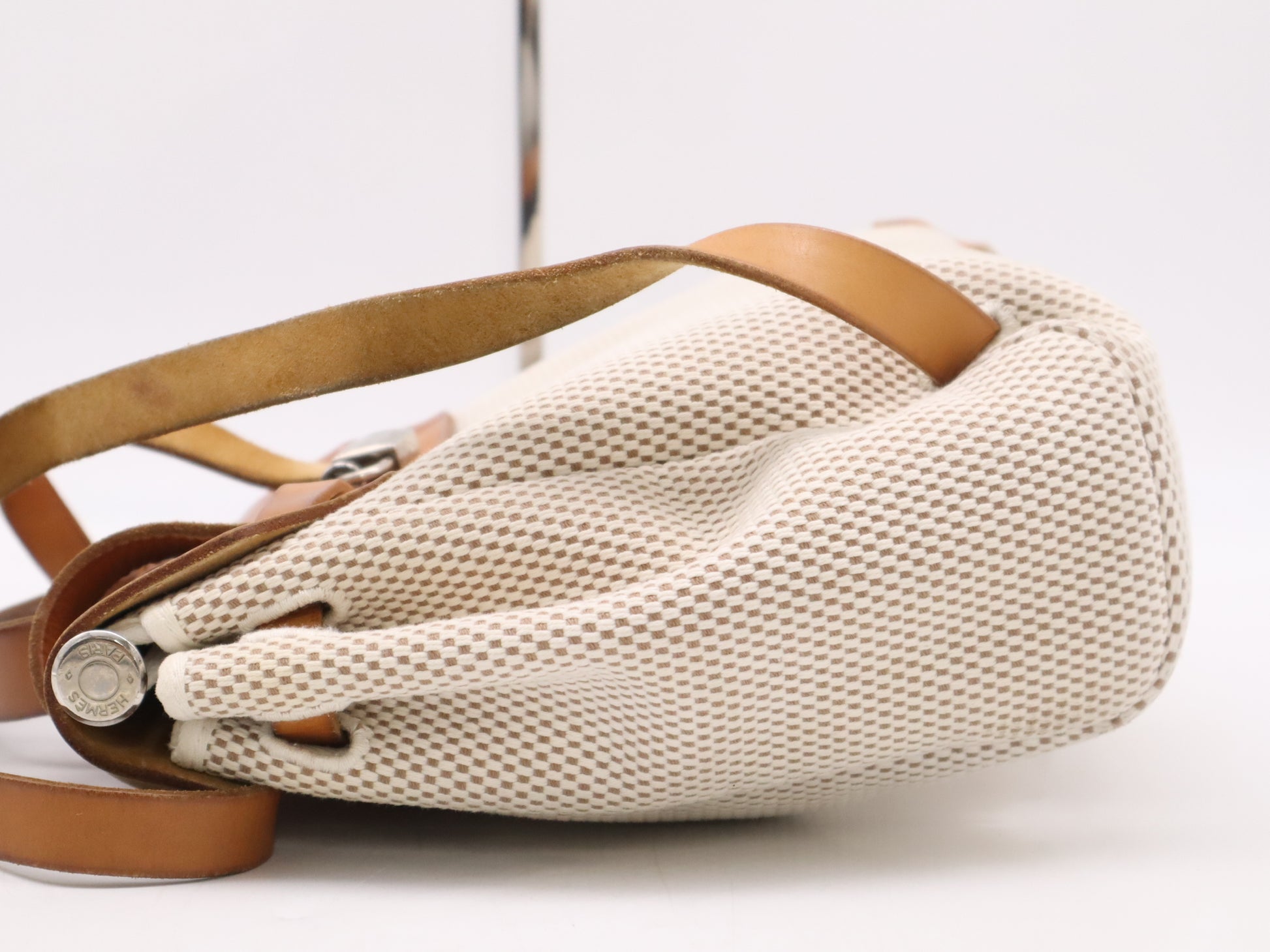 HERMES Toile GM x Leather Air Bag Ad PM Backpack in Brown, Beige, and Natural. Includes a padlock, two keys, a dust bag, and a box. H stamped. 2004.