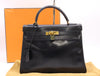 HERMES Box Calf Kelly 32 Black with GD hardware, padlock, two keys, cloche, dust bag, and box. 〇N stamped. 1984.