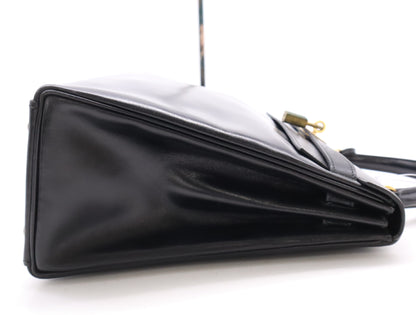 HERMES Box Calf Kelly 32 Black with GD hardware, padlock, two keys, cloche, dust bag, and box. 〇N stamped. 1984.