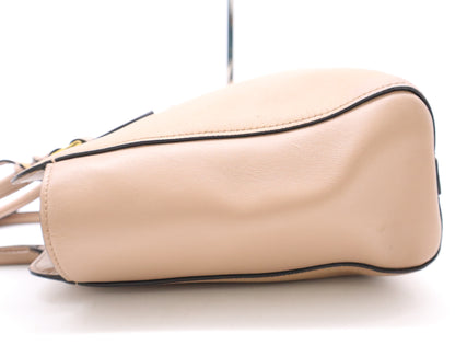 PRADA 2-way leather handbag in pink with GD hardware, shoulder strap, and clochette.