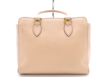 PRADA 2-way leather handbag in pink with GD hardware, shoulder strap, and clochette.