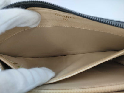 CHANEL Lambskin Camellia Round Zip Wallet