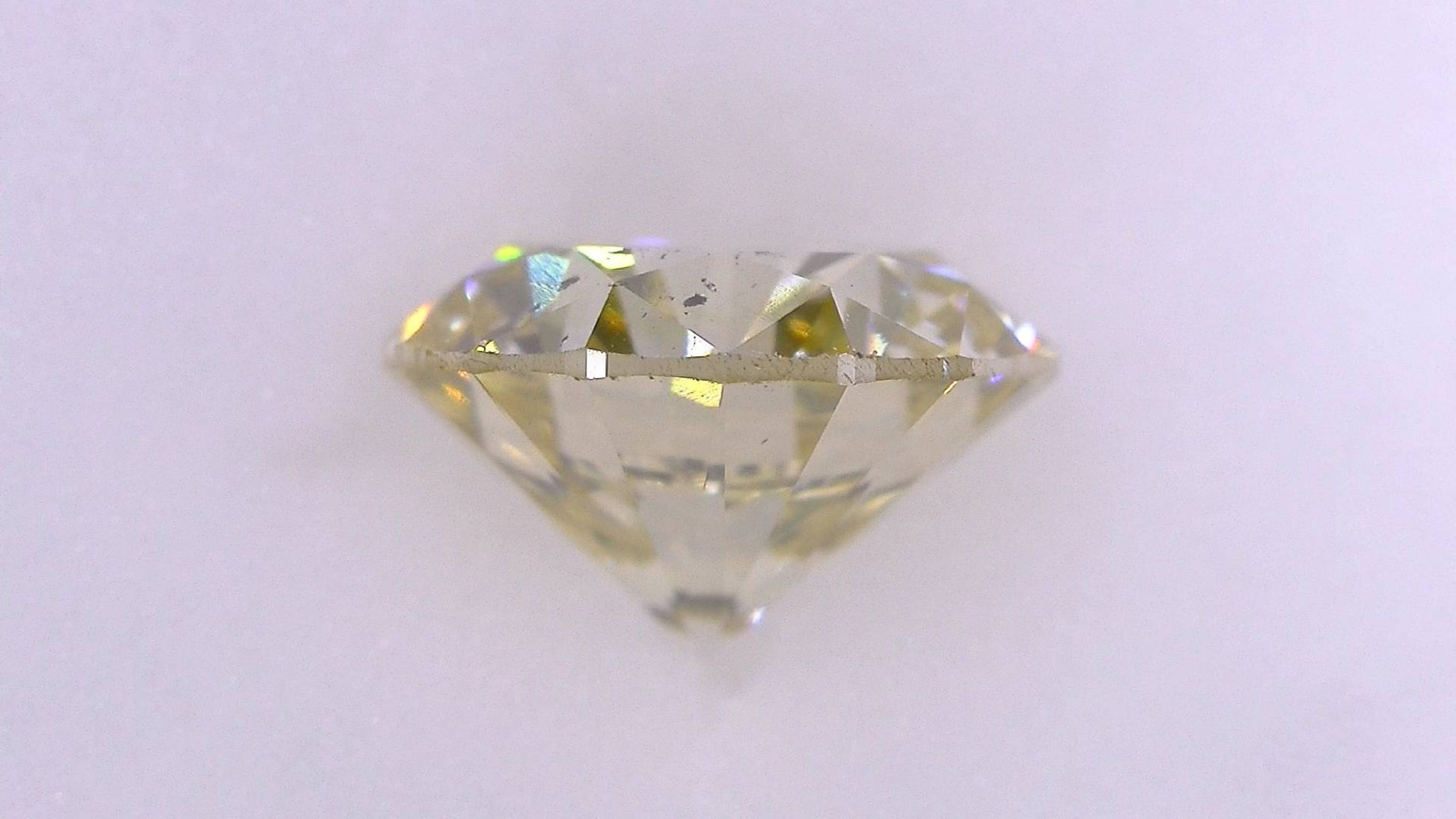 1.183ct Under S) Light Brownish Yellow SI-2 Good/Grade/Grade Strong Blue Natural 6.69-6.75 x 4.14mm Diamond Loose