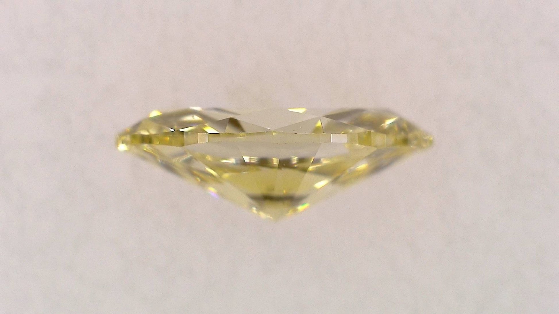 0.107ct Fancy Light Yellow VS-2 ****/GD/GD Strong Yellow Natural 4.59-2.38X1.62mm MQ Diamond Loose