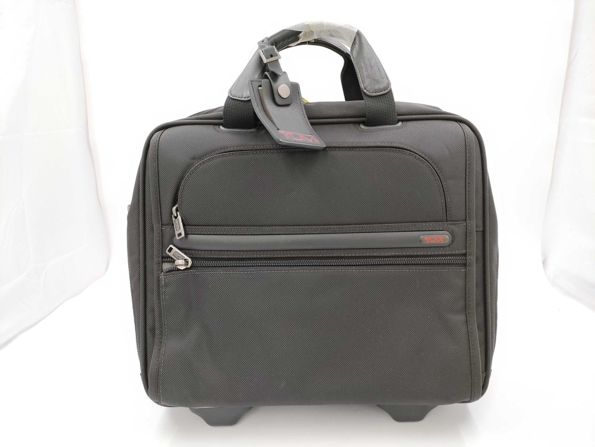 TUMI Boston bag with wheels and tag