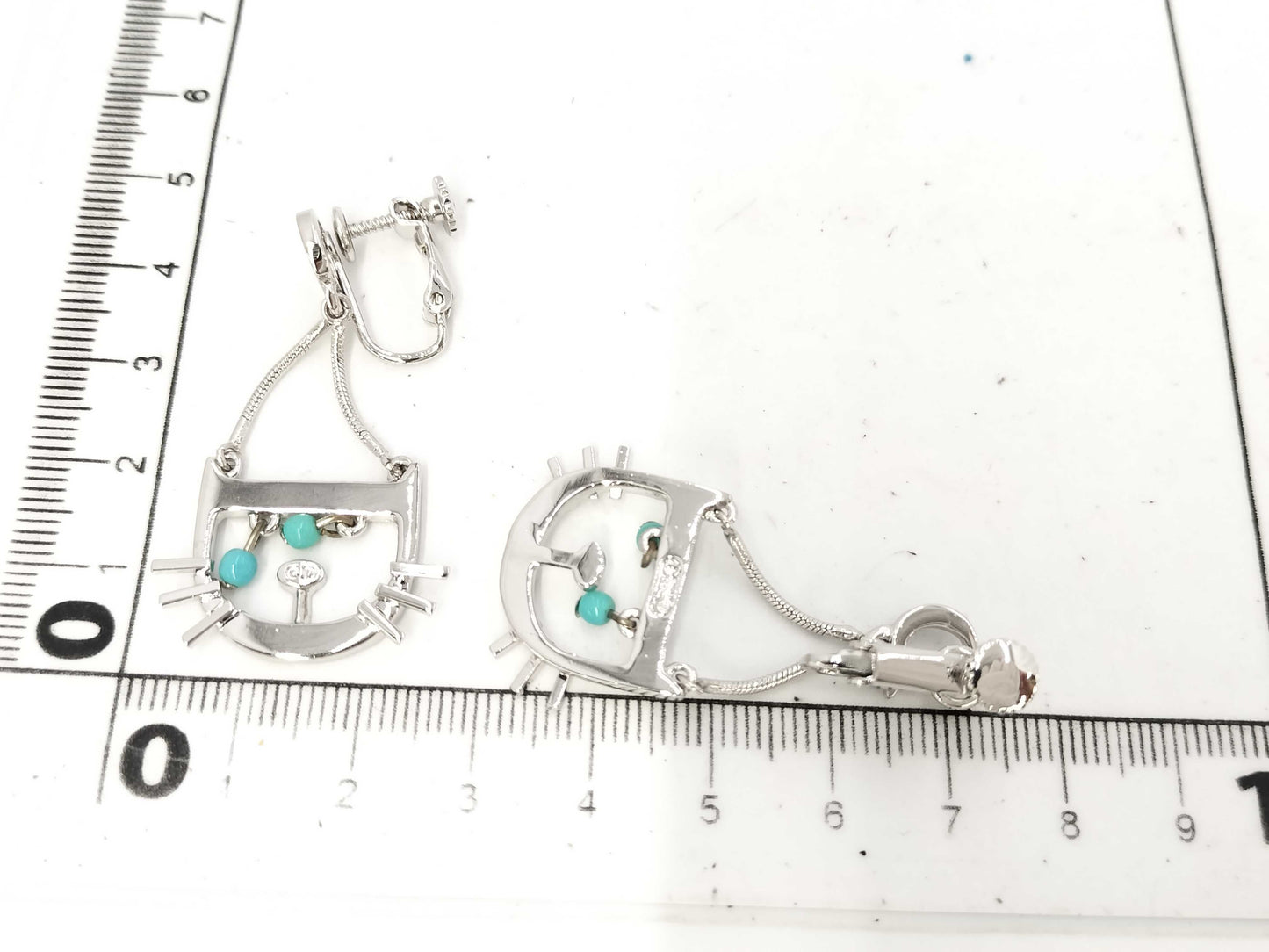 Pair of Dior logo stone earrings