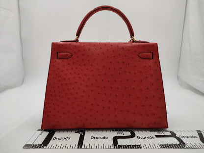 HERMES Kelly 32 Ostrich Handbag in Pink with Gold Hardware