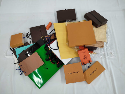 Louis Vuitton, Chanel, Van Cleef & Arpels, and other high-end brand paper storage bags. Empty brand boxes. Empty brand boxes.
