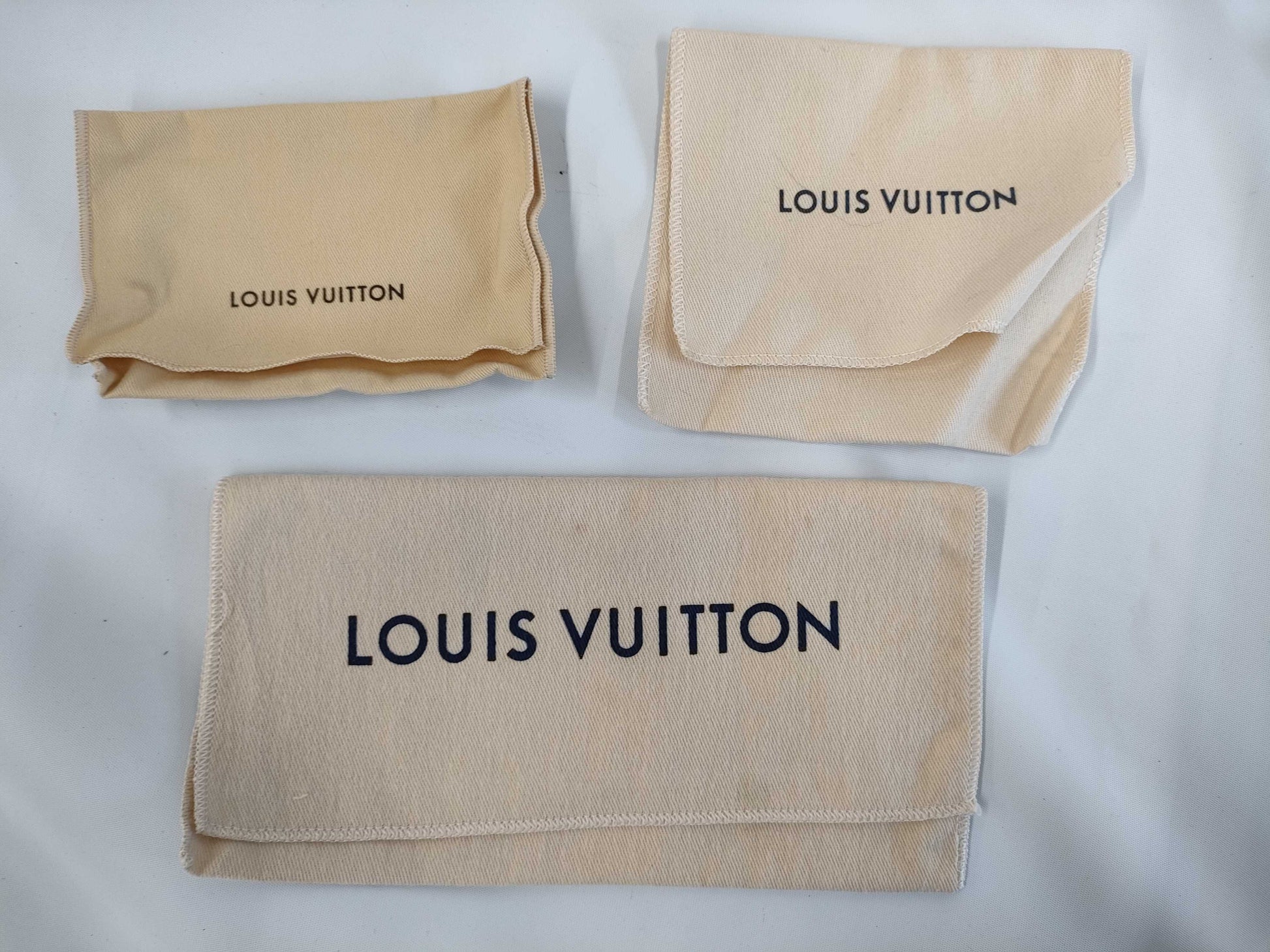 LOUIS VUITTON 27-piece L-tiered bag, approximately 70% empty brand boxes.
