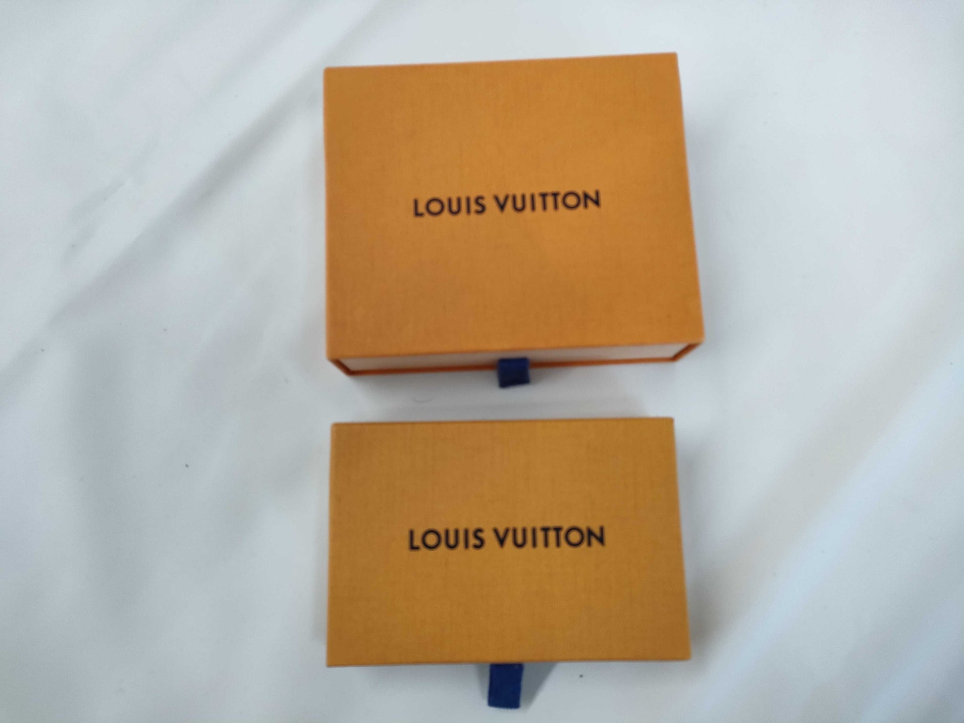 LOUIS VUITTON 27-piece L-tiered bag, approximately 70% empty brand boxes.