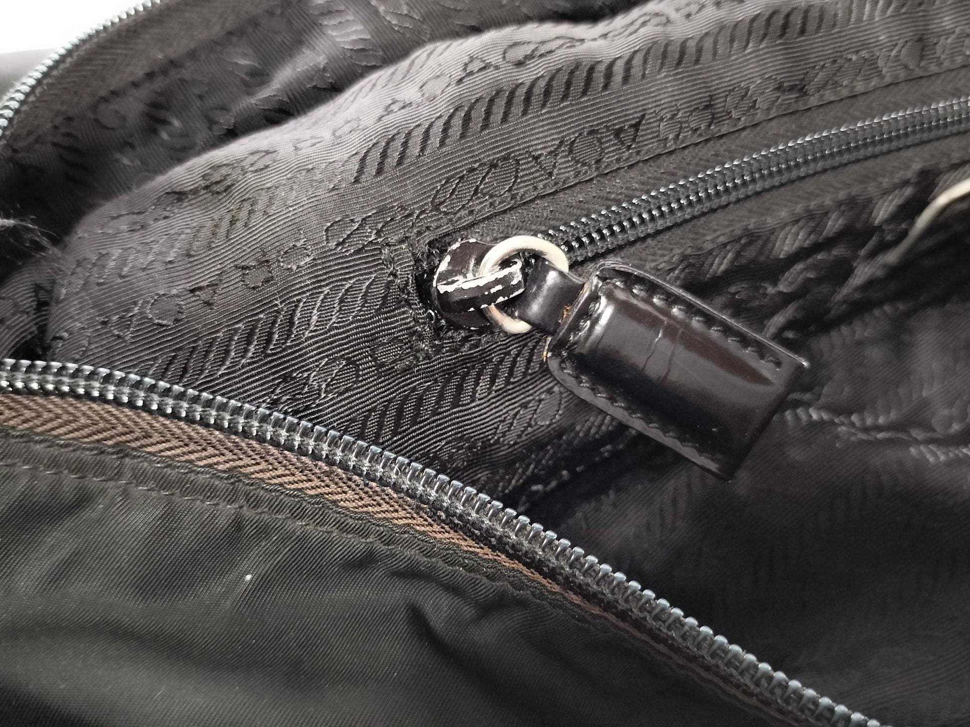 PRADA nylon triangular logo bag, zipper damage, condition considered. Tote bag