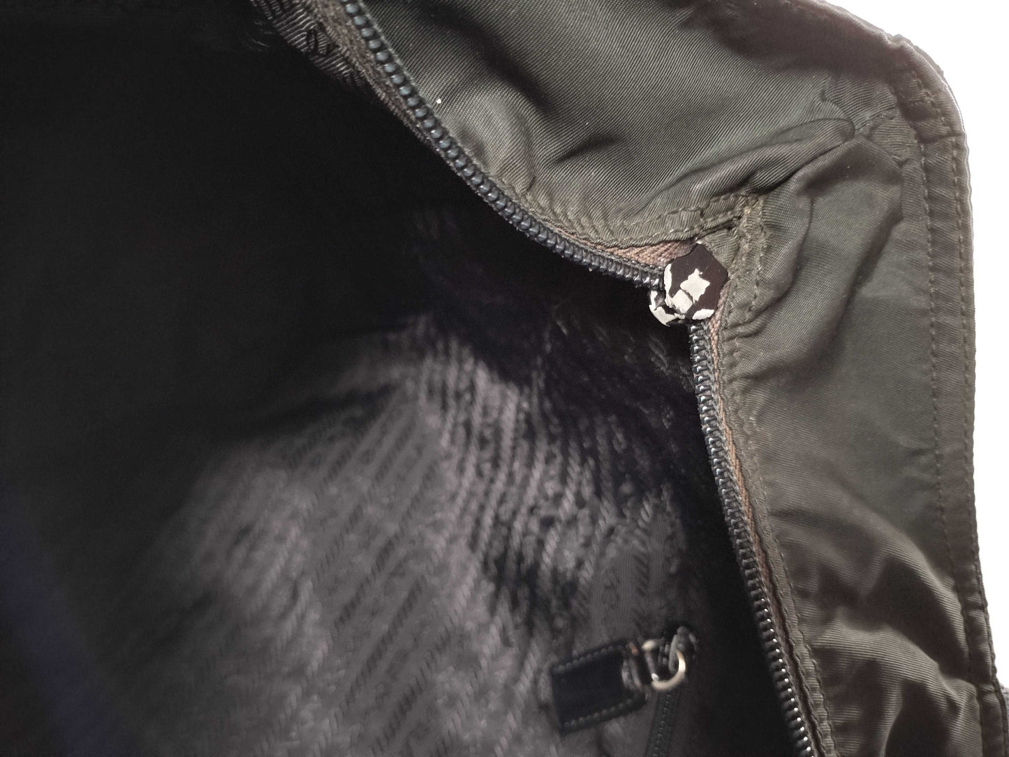 PRADA nylon triangular logo bag, zipper damage, condition considered. Tote bag