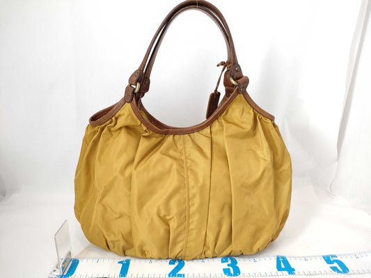 Felisi nylon and leather tote bag in yellow