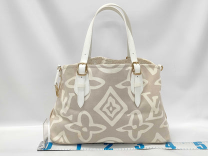 LOUIS VUITTON Taisienne PM Handbag with Stain