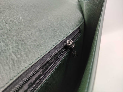 LOUIS VUITTON Taiga flap-style second bag with some deterioration inside the pocket.