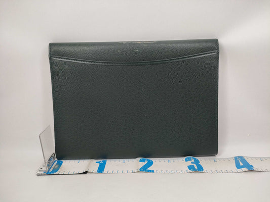 LOUIS VUITTON Taiga flap-style second bag with some deterioration inside the pocket.