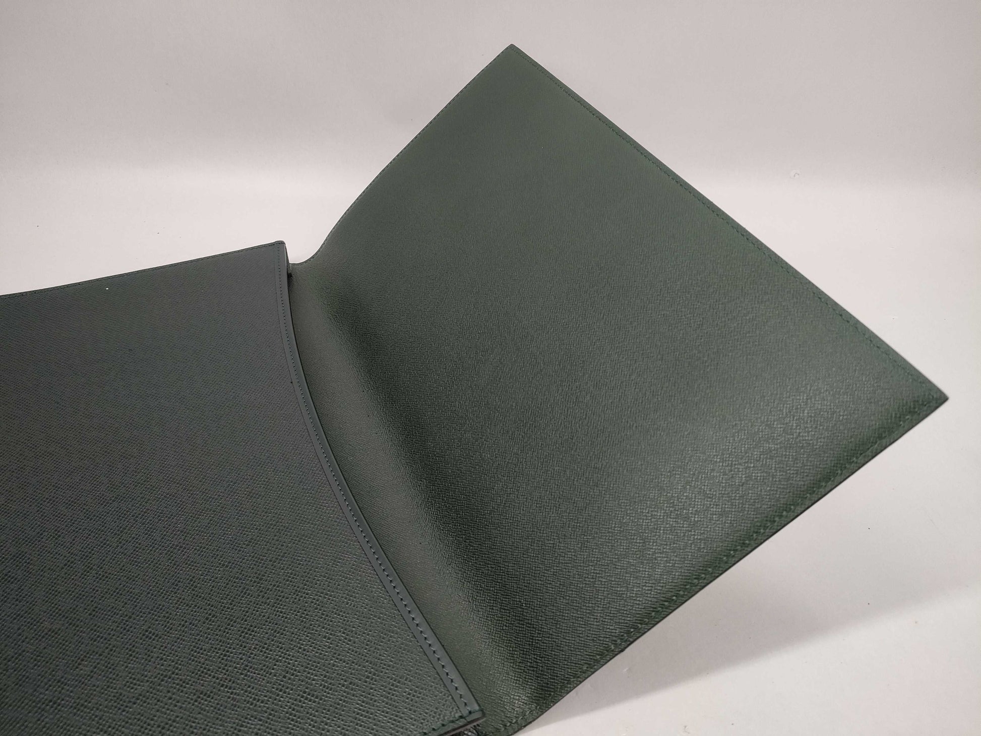 LOUIS VUITTON Taiga flap-style second bag with some deterioration inside the pocket.