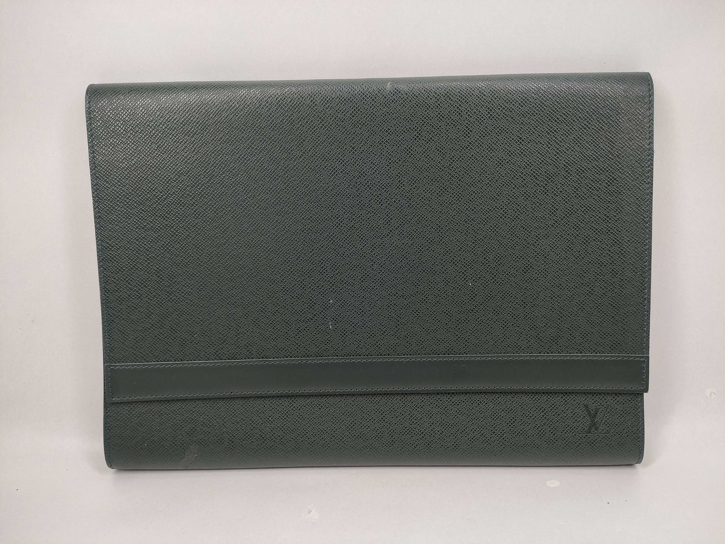 LOUIS VUITTON Taiga flap-style second bag with some deterioration inside the pocket.