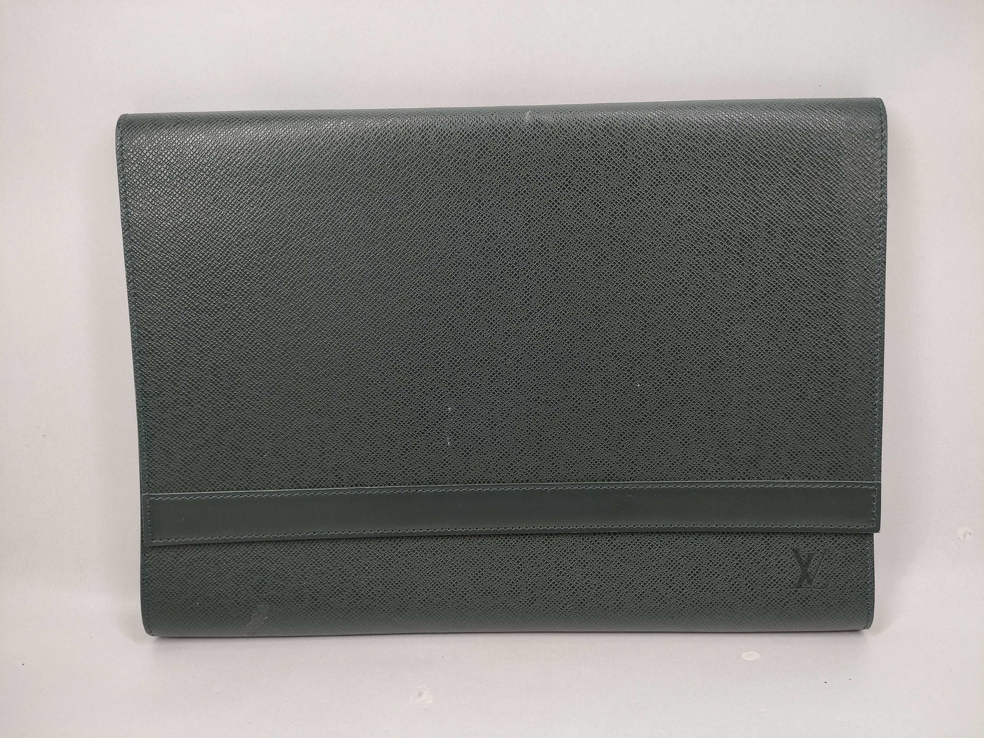LOUIS VUITTON Taiga flap-style second bag with some deterioration inside the pocket.