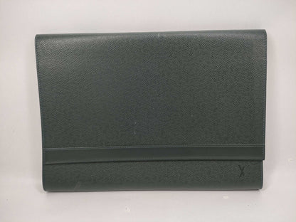 LOUIS VUITTON Taiga flap-style second bag with some deterioration inside the pocket.