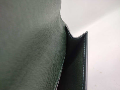 LOUIS VUITTON Taiga flap-style second bag with some deterioration inside the pocket.