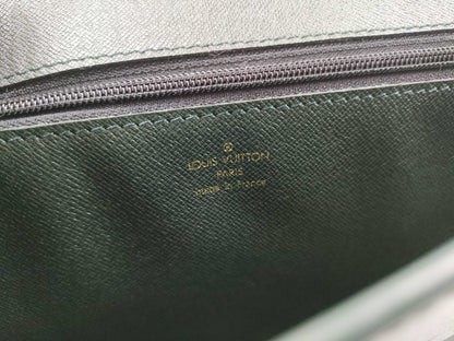 LOUIS VUITTON Taiga flap-style second bag with some deterioration inside the pocket.