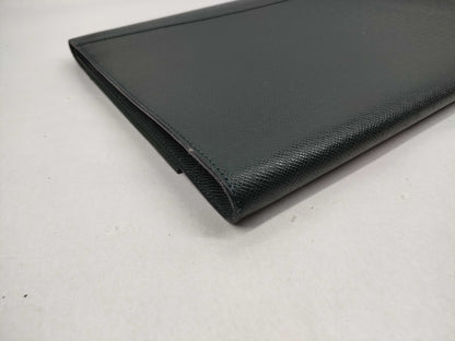 LOUIS VUITTON Taiga flap-style second bag with some deterioration inside the pocket.