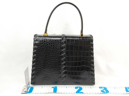 Yves Saint Laurent Embossed Handbag with Charm