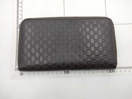GUCCI Microsima GG Round Zip Wallet in Dark Brown
