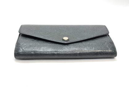 LOUIS VUITTON Monogram Empreinte Giant Monogram Reverse Portefeuille Zoe Wallet