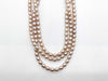 Pearl necklace with a diameter of approximately 7.4mm-8.9mm and diamonds, weighing 94.4g in 14K gold.