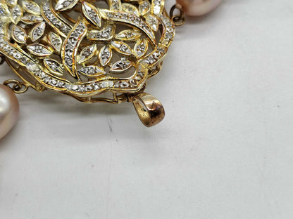 Pearl necklace with a diameter of approximately 7.4mm-8.9mm and diamonds, weighing 94.4g in 14K gold.