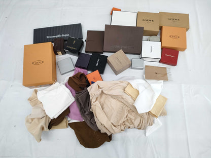 Empty Louis Vuitton, Gucci, Chanel, Loewe, and other brand-name boxes and dust bags. One M-tiered box. Empty brand-name boxes.