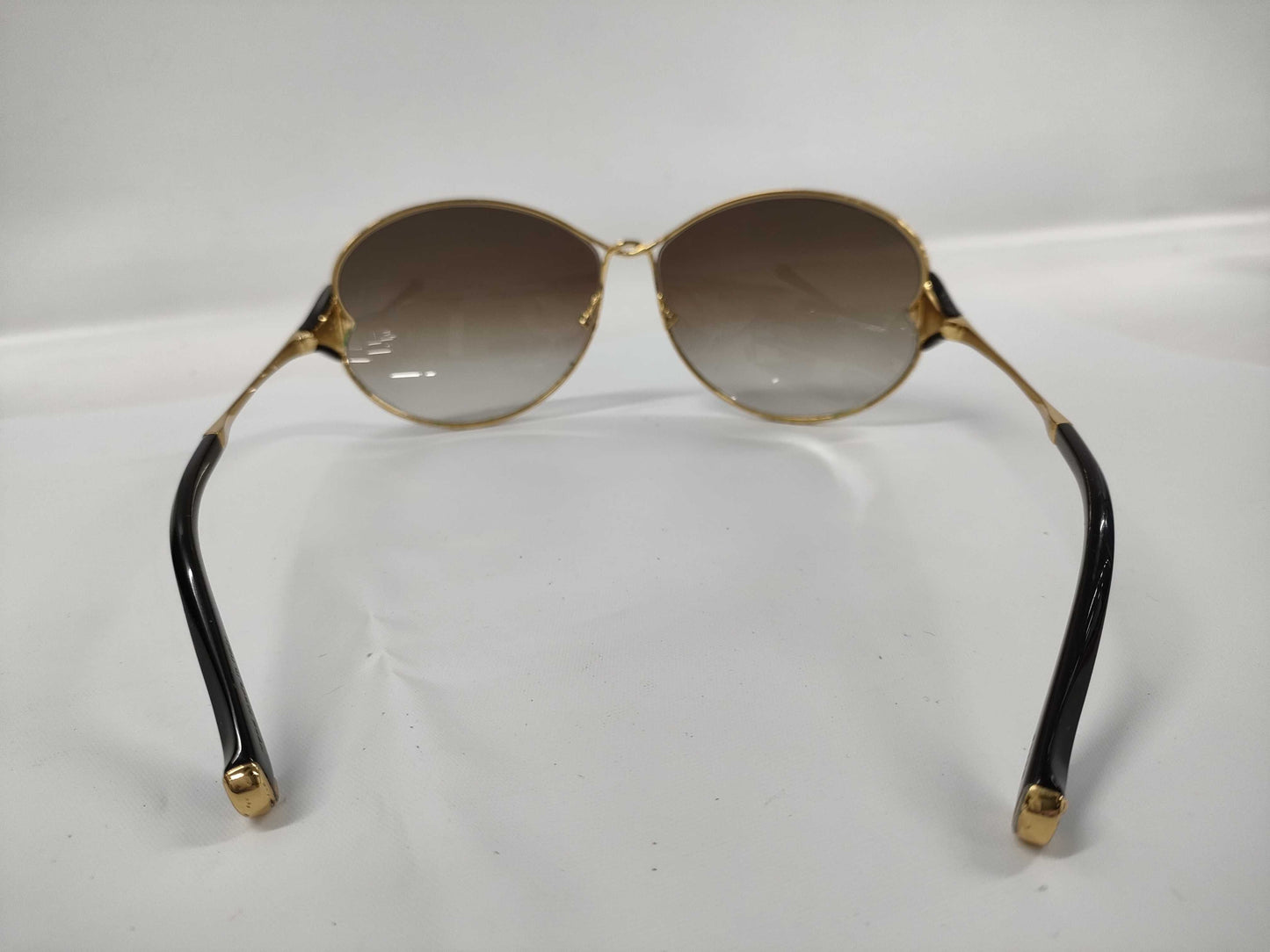 LOUIS VUITTON Daisy Sunglasses with some blue rust sunglasses and glasses