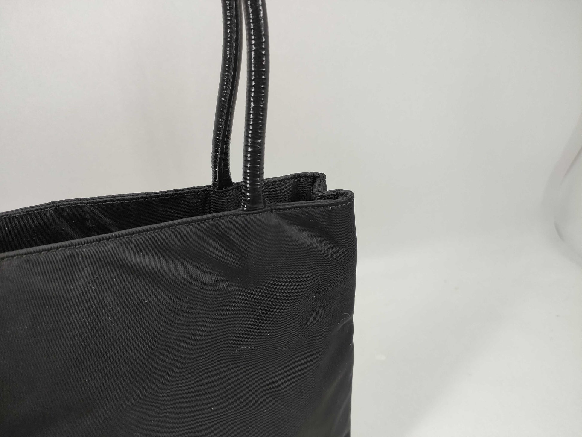 PRADA Nylon Leather Accessory Triangle Tote Bag in Black and Gold