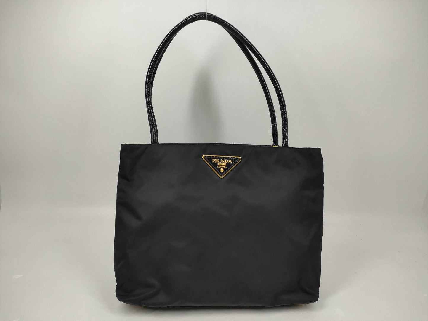 PRADA Nylon Leather Accessory Triangle Tote Bag in Black and Gold