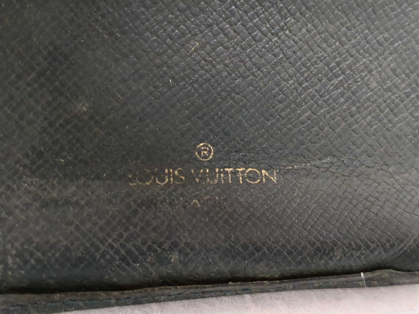 Salvatore Ferragamo, Louis Vuitton, and other wallets