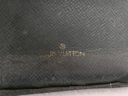 Salvatore Ferragamo, Louis Vuitton, and other wallets