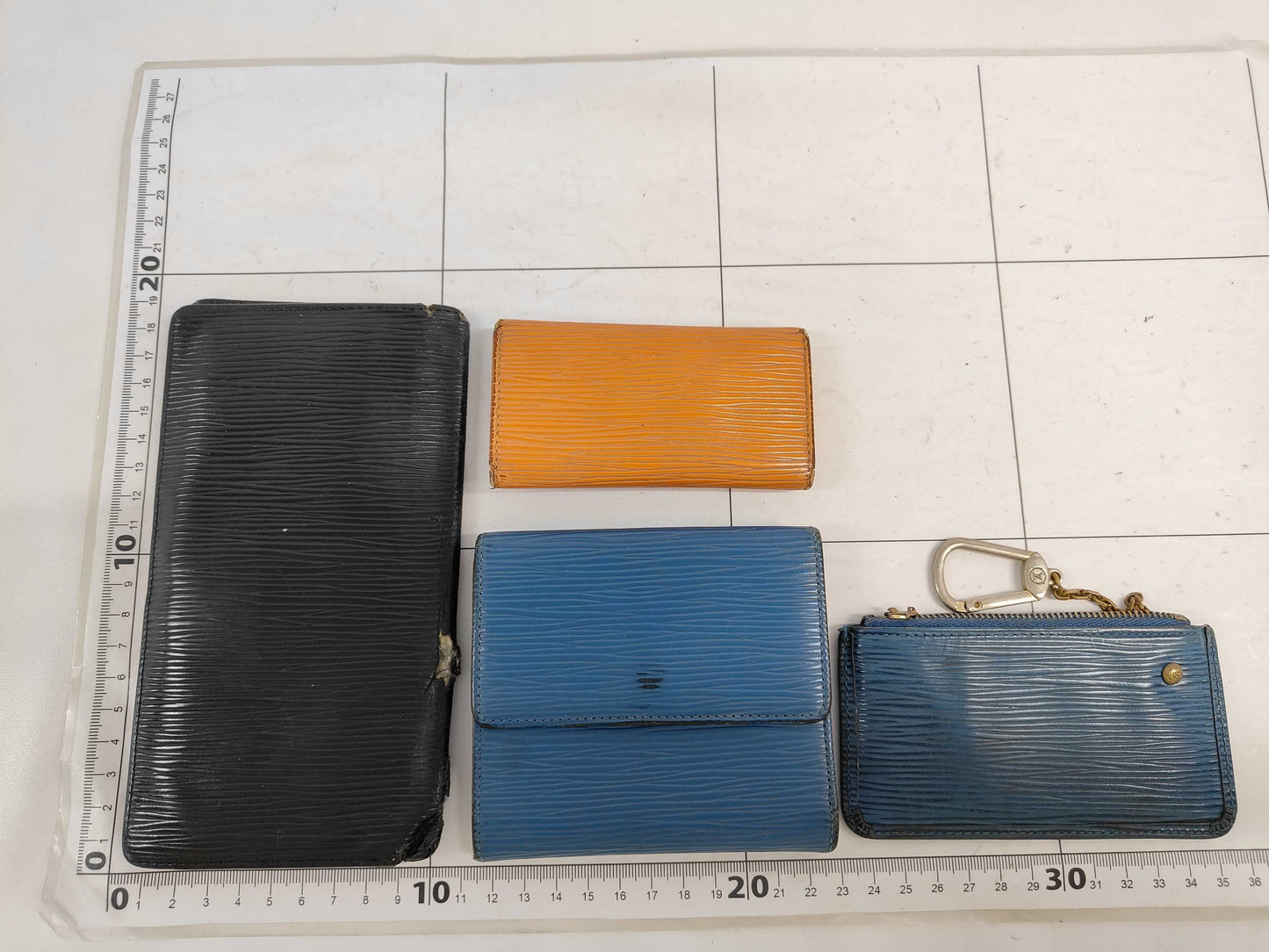 LOUIS VUITTON 9. 5 wallets including Louis Vuitton Epi wallets and other accessories