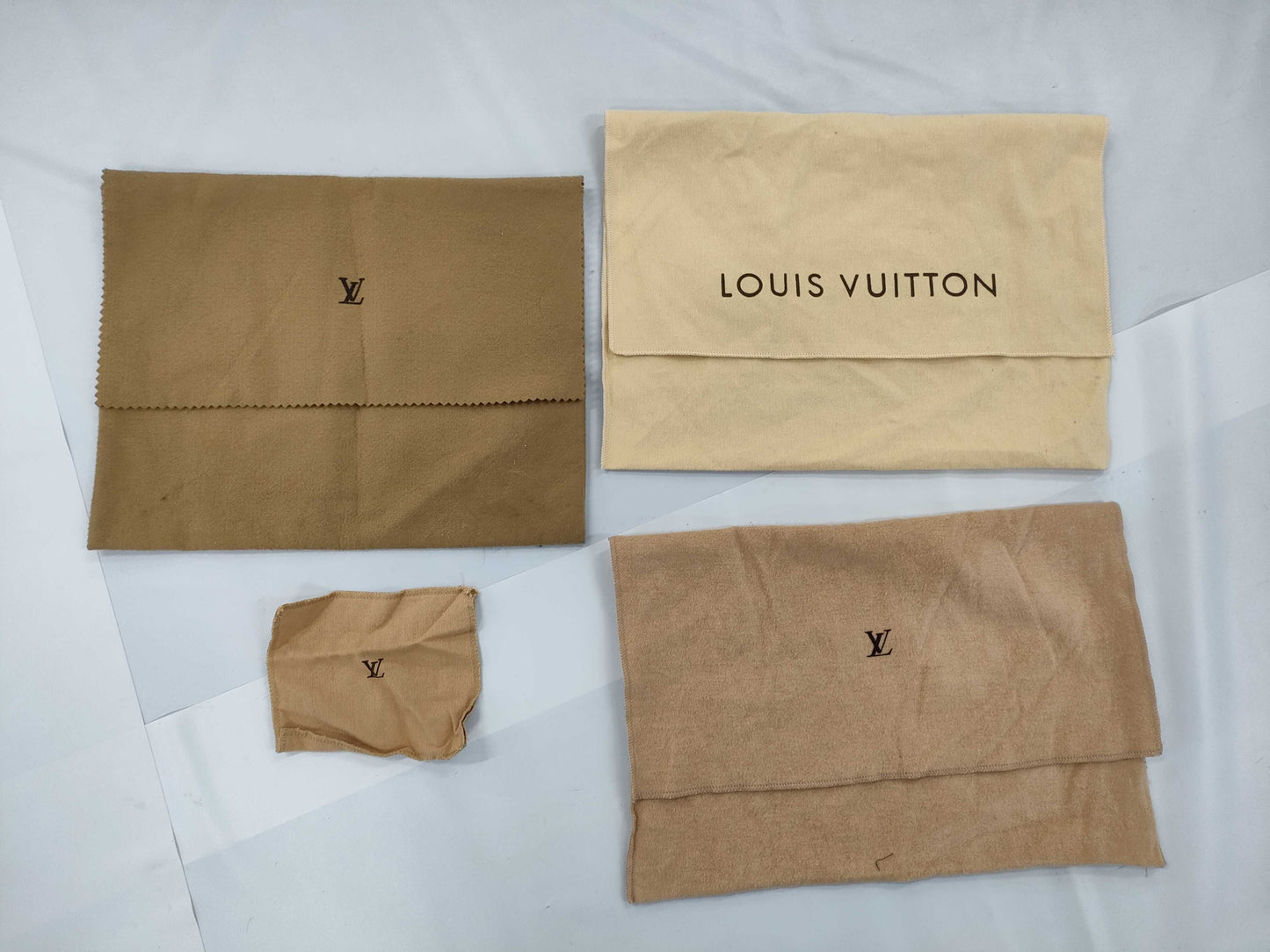 8 storage bags, 6 Louis Vuitton and 2 Hermes storage bags 